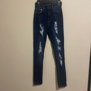 Fashion Nova; dark wash ripped Jeans; size 1/2: fabric: 80% cotton, etc.